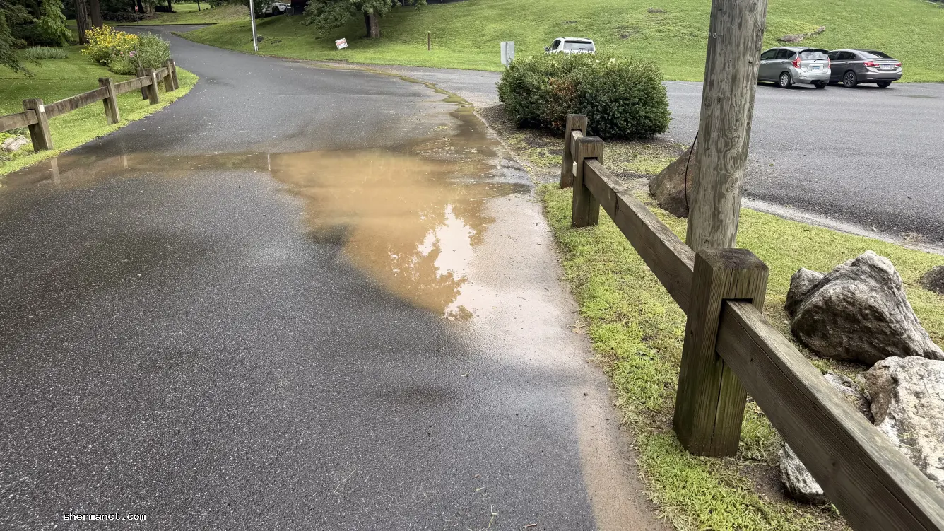 <strong>Environmental Oversight:</strong> Muddy sediment and construction silt from the municipal school project bypass containment, flowing directly into a Candlewood Lake tributary.